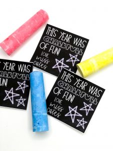 sidewalk chalk with tags that say this year was chalkfull of fun